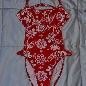 Red and white one piece bathing suit open back